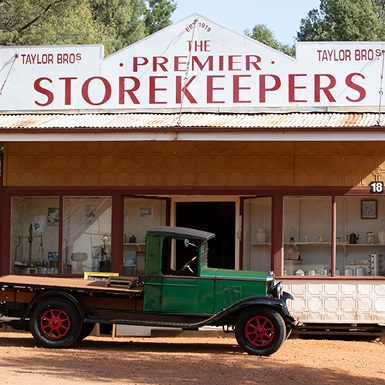 old truck in front of old store